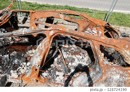A car is on fire and has been destroyed 128724190