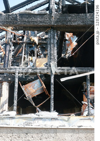 A building is on fire and has been destroyed A building is on fire and has been destroyed 128724196