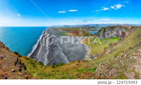 Impressive View of Kirkjufjara black sand beach from Dyrholaey promontory on Atlantic South Coast Impressive View of Kirkjufjara black sand beach from Dyrholaey promontory on Atlantic South Coast 128725043