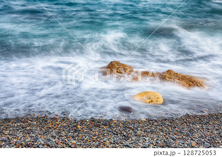Seascape during sunset. Beautiful natural seascape at long exposure. 128725053