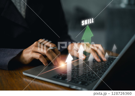 Businessperson enhancing skills on a laptop with growth arrows, symbolizing career advancement and personal development. 128726360