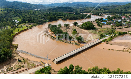 Aerial view of a broken bridge in Doi Hang subdistrict after Typhoon Yagi has swept Chiang Rai province of Thailand. 128727258