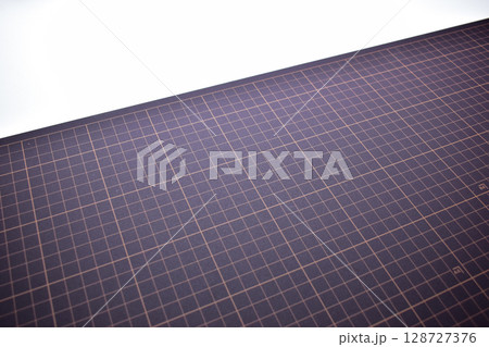 black cutting mat board on white background with line and scale measure guide pattern for object art design, tool equipment of diy craft work 128727376