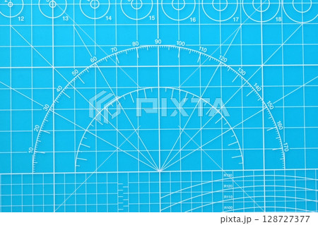 blue cutting mat board background with line and scale measure guide pattern for object art design blue cutting mat board background with line and scale measure guide pattern for object art design 128727377