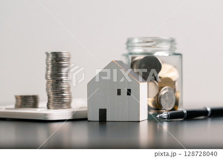 Business home concept involves strategic financial management money coin save bank real estate economic loan investment development growth encourage accountancy buy income stack investment economy 128728040
