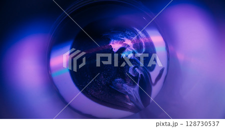 Neon paint spill. Round light. Defocused purple pink green color droplets rainbow texture floating on abstract fluorescent art background. Neon paint spill. Round light. Defocused purple pink green color droplets rainbow texture floating on abstract fluorescent art background. 128730537