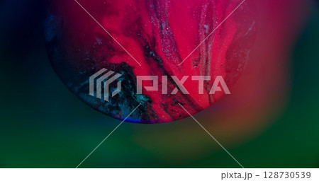 Emulsion spilling. Flowing paint. Defocused pink blue neon color glitter water floating on abstract creative bokeh light background. Emulsion spilling. Flowing paint. Defocused pink blue neon color glitter water floating on abstract creative bokeh light background. 128730539