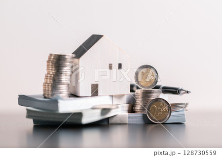 Business home concept involves strategic financial management money coin save bank real estate economic loan investment development growth encourage accountancy buy income stack investment economy 128730559