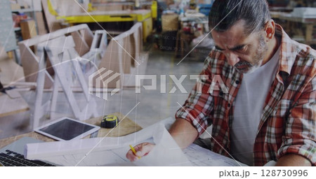 Image of financial graphs over senior caucasian man in carpentry workshop Image of financial graphs over senior caucasian man in carpentry workshop 128730996