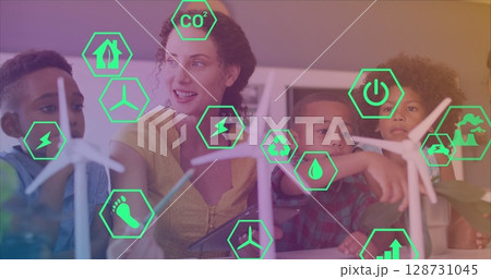 Image of eco icons over happy caucasian female teacher and class of diverse pupils 128731045