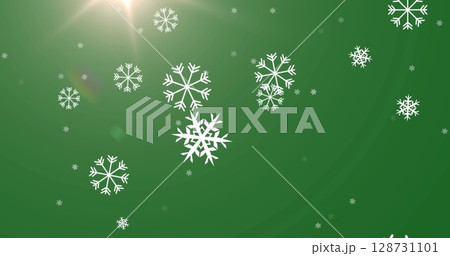 Image of snow falling over christmas decorations on green background Image of snow falling over christmas decorations on green background 128731101