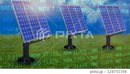 Rotating blue tinted solar panels tracking sunlight on black mounts in field, with data overlays Rotating blue tinted solar panels tracking sunlight on black mounts in field, with data overlays 128731356