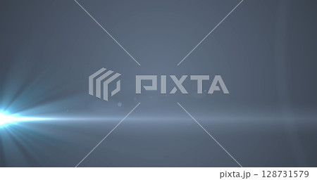 Digital image of blue spot of light against grey background 128731579