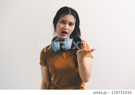 Asian girl expresses dislike, person express negative feeling, concept business complaint from customer ensuring employee satisfaction negative feedback to prevent mental strain customer dislike 128731816