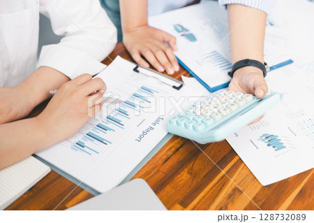 Teamwork with business people analysis cost graph on desk at meeting room. partnership analysis graph company financial budget report, cost work progress planning, business team analysis graph data 128732089