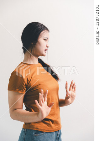 Asian girl expresses dislike, person express negative feeling, concept business complaint from customer ensuring employee satisfaction negative feedback to prevent mental strain customer dislike Asian girl expresses dislike, person express negative feeling, concept business complaint from customer ensuring employee satisfaction negative feedback to prevent mental strain customer dislike 128732101