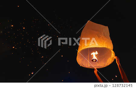 Tourist floating sky lanterns in Loy Krathong festival , Chiang Mai ,Thailand. Tourist floating sky lanterns in Loy Krathong festival , Chiang Mai ,Thailand. 128732145