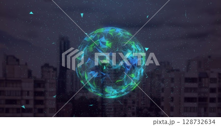 Floating sphere showing green-blue facets above city skyline at dusk, with floating particles Floating sphere showing green-blue facets above city skyline at dusk, with floating particles 128732634