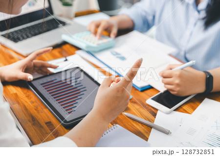 Teamwork with business people analysis cost graph on desk at meeting room. partnership analysis graph company financial budget report, cost work progress planning, business team analysis graph data 128732851