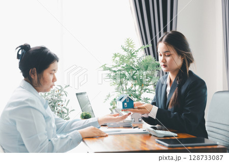 Real estate agent delivering sample home to customer, mortgage loan contract. Contract for hire purchase sale of house. home insurance contract, home mortgage loan concept. real estate, customer Real estate agent delivering sample home to customer, mortgage loan contract. Contract for hire purchase sale of house. home insurance contract, home mortgage loan concept. real estate, customer 128733087