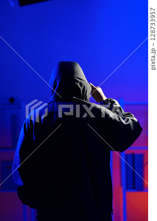 Anonymous hacker thief criminal man 128733957