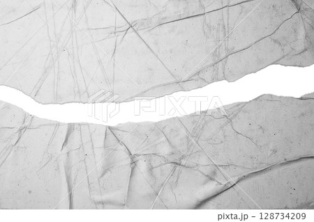 Gap of a ripped white paper on a white background. Copy space Gap of a ripped white paper on a white background. Copy space 128734209