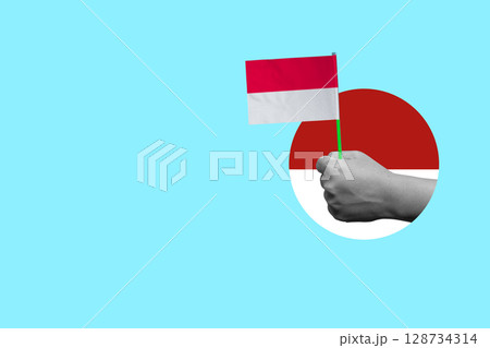 Human hand holding the Indonesian flag to celebrate Indonesia Independence Day. Collage art. Concept of Kemerdekaan Human hand holding the Indonesian flag to celebrate Indonesia Independence Day. Collage art. Concept of Kemerdekaan 128734314