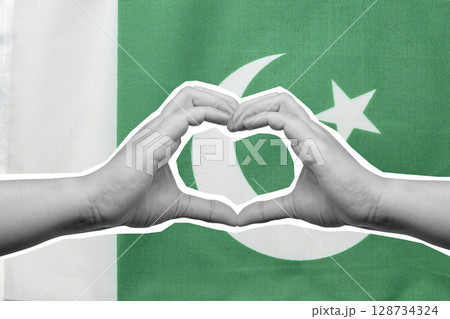 Human hand showing heart gesture with the Pakistan national flag. Concept of Pakistan Independence Day. Collage art Human hand showing heart gesture with the Pakistan national flag. Concept of Pakistan Independence Day. Collage art 128734324