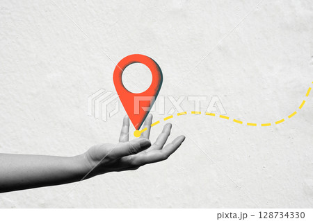 Human hand showing a location map pin. Concept of travel. Collage art Human hand showing a location map pin. Concept of travel. Collage art 128734330