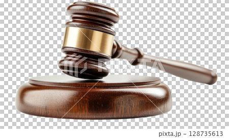 Gavel resting on a wooden base used in court for legal proceedings during daytime 128735613