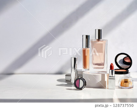 Minimalist composition of luxury skincare and makeup products in natural light with dramatic shadows on white background 128737550