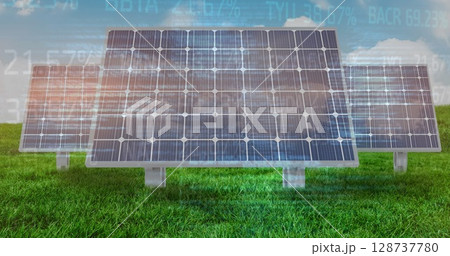 Image of financial data processing over solar panels and landscape Image of financial data processing over solar panels and landscape 128737780
