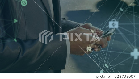 Image of network of connections over businessman a using smartphone Image of network of connections over businessman a using smartphone 128738007