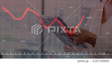 Executive using tablet in office, with red line chart overlay, numeric labels, grid, copy space Executive using tablet in office, with red line chart overlay, numeric labels, grid, copy space 128738060