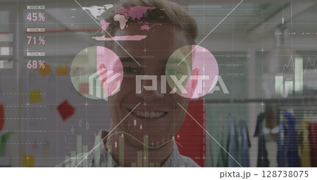 Statistical data processing against portrait of caucasian man smiling at office Statistical data processing against portrait of caucasian man smiling at office 128738075