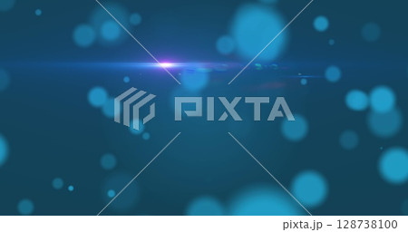 Digital image of spots of light and blue light trail against blue background 128738100