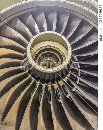 Jet turbine engine blades in close-up, symmetrical mechanical pattern. High quality photo Jet turbine engine blades in close-up, symmetrical mechanical pattern. High quality photo 128739687