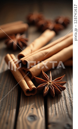 Macro Close-up of Cinnamon Sticks and Star Anise on Rustic Wood 128741617