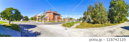 Brest Belarus colorful village streets with wooden huts brick houses . 128742120