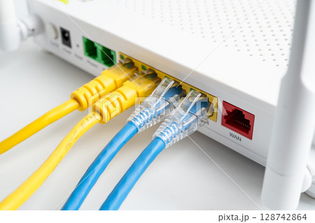 Ethernet cable with wireless router connect to internet service provider internet network. Ethernet cable with wireless router connect to internet service provider internet network. 128742864