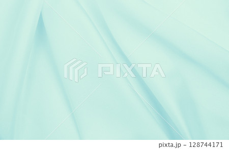 Smooth elegant blue silk or satin luxury cloth texture as abstract background. Luxurious background design Smooth elegant blue silk or satin luxury cloth texture as abstract background. Luxurious background design 128744171