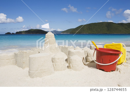 Sandcastle and buckets on Cinnamon Bay Beach 128744655