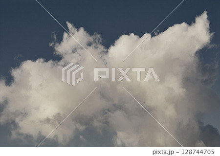 Dramatic clouds against blue sky Dramatic clouds against blue sky 128744705