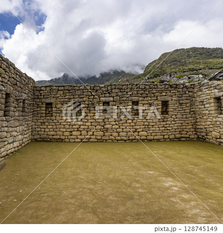 Clouds over Machu Picchu Inca ruins Clouds over Machu Picchu Inca ruins 128745149