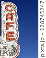 Low angle view of old Cafe neon sign 128745247