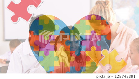 Autism awareness day text over caucasian female teacher and students at school 128745891