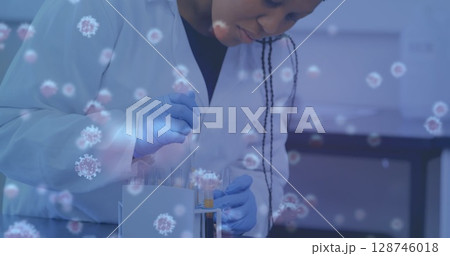 Image of virus cells over female scientist with test tubes 128746018