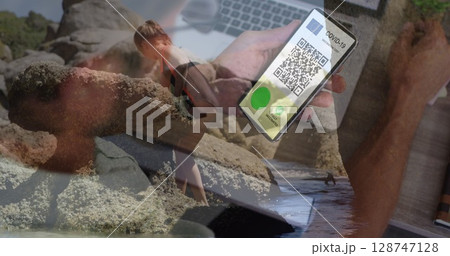 Image of caucasian woman with smartphone over caucasian girl at beach Image of caucasian woman with smartphone over caucasian girl at beach 128747128