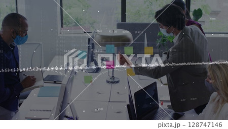 Data processing against diverse office colleagues wearing face masks discussing over memo notes Data processing against diverse office colleagues wearing face masks discussing over memo notes 128747146