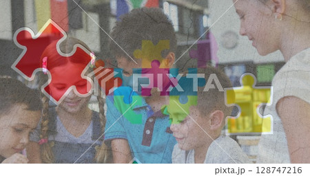 Image of colorful puzzle and heart over diverse children with tablets Image of colorful puzzle and heart over diverse children with tablets 128747216